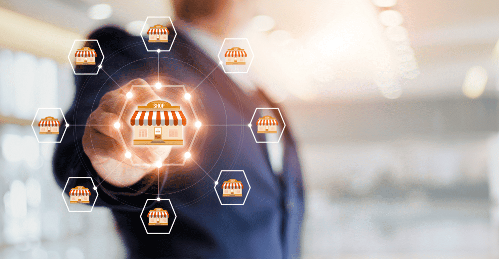 business lawyer pointing to a brick and mortar image signaling franchising