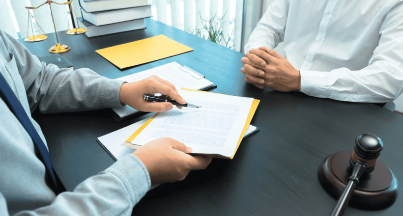 trademark attorney speaking to a client about trademarks and IP laws